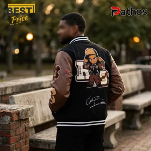 Black and brown varsity jacket with anime character patch, white stripe collar and cuffs, and embroidered back detail.!