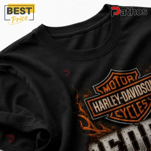 Black cotton t-shirt featuring an orange and silver Harley-Davidson Motor Cycles logo with flame graphics.!