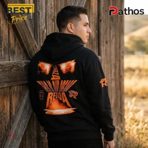 Man wearing a black cotton hoodie with orange graphic print of car headlights and Fuerza Regida text on the back.!