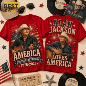 Red Alan Jackson graphic t-shirts featuring country singer, acoustic guitar, American flag, and 1776-2026 text on fabric.!