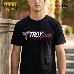 Troy Trojans 2026 College World Series Omaha Baseball Shirt 1 Man wearing a black crewneck t-shirt with a maroon and white Troy Trojans collegiate logo graphic on the chest.!