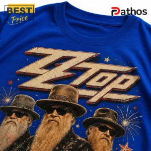 ZZ Top Red White and Blue Patriotic 2026 Shirt 4 Royal blue t-shirt featuring a ZZ Top band graphic with members in fedoras, beards, and sunglasses with fireworks graphics.!