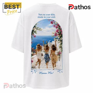 White oversized t-shirt featuring three women running down stairs toward the Greek sea with floral arches and Mamma Mia text.!