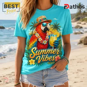 Cyan t-shirt featuring a parrot wearing a straw hat, sunglasses, and flower lei holding a drink with Summer Vibes text.!