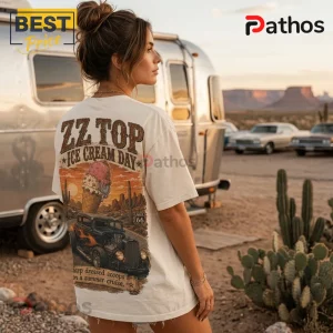 Woman wearing an off-white graphic t-shirt featuring ZZ Top text, an ice cream cone, hot rod, and Route 66 sign design.!