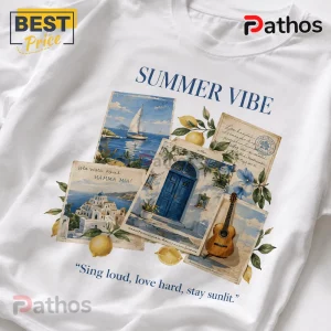 White cotton t-shirt featuring Greek island collage with sailboat, blue doors, guitar, lemons, and text Summer Vibe.!