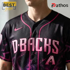 Black Arizona Diamondbacks baseball jersey with pink lettering, trim, and marble pattern worn by a male torso.!