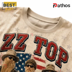 ZZ Top America 250 Honoring Freedom Rock Band Patriotic Shirt 3 ZZ Top band graphic t-shirt featuring three band members, American flag patterns, and stars on a beige cotton fabric.!
