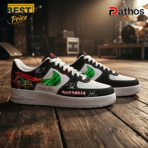 Custom Iron Maiden graphic sneakers with green flame swoosh, white leather, black accents, and band signatures.!