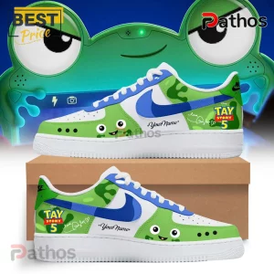 Custom green and white sneakers featuring Toy Story 5 branding, frog graphics, blue swooshes, and editable name space.!