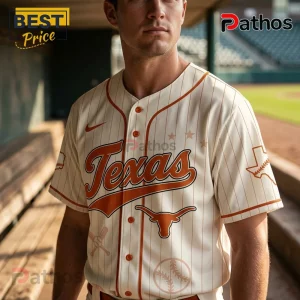 Cream baseball jersey with Texas script, orange pinstripes, Longhorn logo, and state graphics on a male model.!
