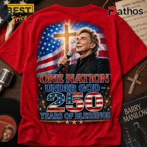 Red graphic t-shirt featuring Barry Manilow, a glowing cross, and American flag print with text One Nation Under God.!