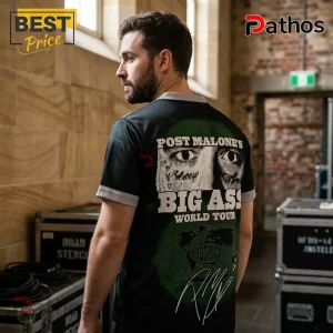 North Melbourne x Post Malone Big Ass World Tour 2026 Football Jersey 2 Man wearing a black and green Post Malone Big Ass World Tour t-shirt with portrait, globe graphic, and signature print.!