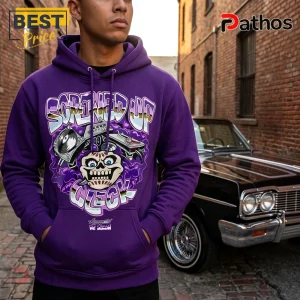 Man wearing a purple hooded sweatshirt with Screwed Up Click graphic featuring a skull, turntable, and graffiti text.!
