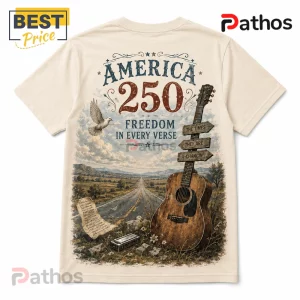 USA 250th Anniversary Heritage Guitar Off-White T-Shirt 3 Cream-colored t-shirt featuring America 250 graphic, acoustic guitar, harmonica, dove, and highway scene with text elements.!