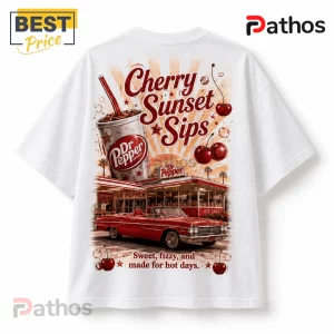 White t-shirt featuring vintage Dr Pepper Cherry graphic with a red convertible car, soda cup, and sunset background.!