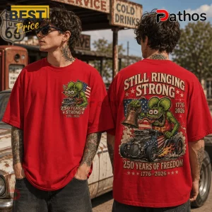 Red oversized t-shirt featuring a green cartoon mouse character, hot rod car, Liberty Bell, and USA flag graphics.!