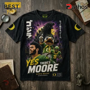 Black cotton t-shirt featuring Godzilla, Oregon Ducks mascot, and Dante Moore with Japanese text on a wooden background.!