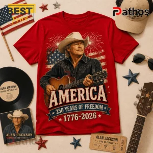 Red graphic t-shirt featuring Alan Jackson, an acoustic guitar, fireworks, and the text America 250 Years of Freedom.!