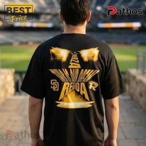 Fuerza Regida x San Diego Padres 2026 This Is Our Dream Black Baseball Jersey 1 Black baseball jersey with back graphic featuring yellow star, stadium lights, and text Fuerza Regida and SD logo.!