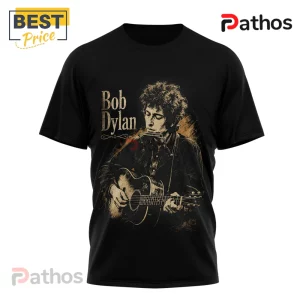Premium Bob Dylan The Times They Are A-Changin Shirt 1 Black short-sleeve cotton t-shirt featuring a gold-toned graphic of Bob Dylan playing acoustic guitar and harmonica.!