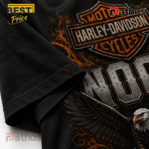 Black Harley-Davidson graphic t-shirt featuring an orange eagle and metallic-style lettering on a textured fabric surface.!