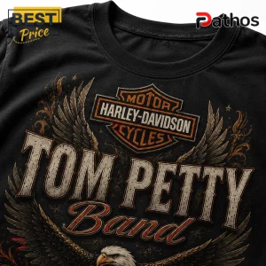 Black cotton t-shirt featuring a Harley-Davidson logo, eagle wings, and Tom Petty Band text in vintage orange and grey.!