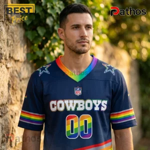 Dallas Cowboys x LGBT Pride Limited Edition Football Jersey 2 Man wearing a navy blue Dallas Cowboys jersey with rainbow trim on the V-neck, sleeves, and number 00.!