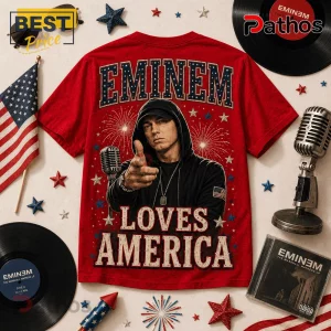 Red cotton t-shirt featuring Eminem in a black hoodie, pointing forward, with fireworks and text Eminem Loves America.!
