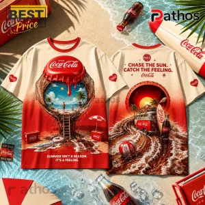 Cream and red Coca-Cola graphic t-shirt featuring beach imagery, bottle cap artwork, and summer-themed slogans.!