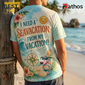 Back view of light blue t-shirt featuring Courage the Cowardly Dog, hibiscus flowers, a compass, and tropical sun print.!