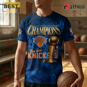 New York Knicks 2026 NBA Champions graphic t-shirt in navy blue with gold championship trophy and basketball logo graphics.!
