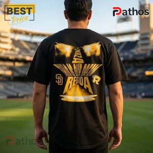 Fuerza Regida x San Diego Padres 2026 This Is Our Dream Black Baseball Jersey 3 Black t-shirt featuring a gold graphic of a star, baseball stadium lights, and text reading Fuerza Regida and SD logo.!