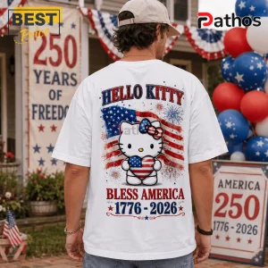 Hello Kitty America 1776-2026 Bless America Independence Day Patriotic Shirt 4 Man wearing white t-shirt featuring Hello Kitty holding a US flag heart, fireworks, and text Bless America 1776-2026.!