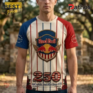 Red Bull branded t-shirt with red and blue sleeves, vertical stripes, 1776 star accents, and 250 graphic on cream fabric.!