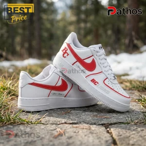 BC Lions Personalized Pacific Frost Custom AIr Force 1 Sneakers 2 White leather sneakers with red swoosh accents and BC Lions text branding on a stone path background.!