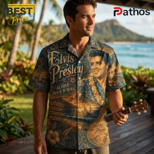 Man wearing Elvis Presley aloha shirt featuring tropical patterns, scenic Hawaii beach, and vintage rock and roll text.!