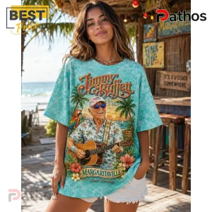 Jimmy Buffett Margaritaville Paradise Song Titles Island T-Shirt 3 Woman wearing oversized light blue tie-dye t-shirt featuring a Jimmy Buffett graphic with guitar, parrot, and tropical art.!