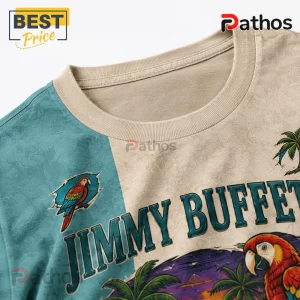Jimmy Buffett graphic t-shirt featuring tropical parrot illustrations, palm trees, and beige and teal color blocking.!