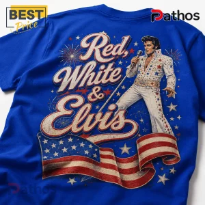Blue t-shirt featuring Elvis Presley in a rhinestone jumpsuit, US flag, fireworks, and text reading Red, White & Elvis.!