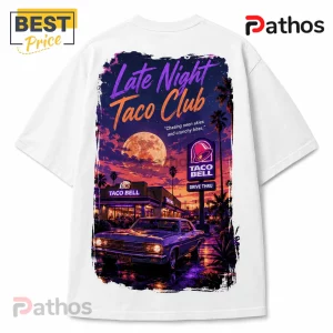White t-shirt featuring a retro neon art graphic of a Taco Bell at night with a classic car under a large full moon.!