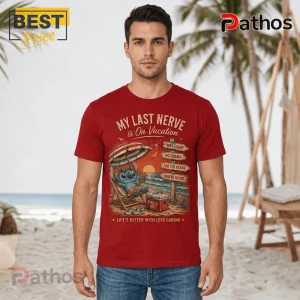 Stitch Sun & Chill Red T-Shirt 2026 3 Red cotton crewneck t-shirt featuring Stitch sitting in a beach chair with a cooler, sun, and wooden signs on the sand.!