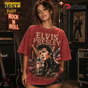 Woman wearing an oversized red vintage-wash t-shirt featuring a portrait of Elvis Presley and Memphis concert graphics.!