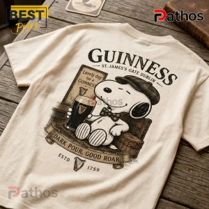 Guinness x Snoopy Vintage Cream T-Shirt 5 Cream-colored t-shirt featuring Snoopy wearing a flat cap and bowtie holding a Guinness stout glass on the back graphic.!