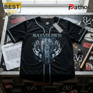 Black Veil Brides Vindicatour baseball jersey with coffin and skeleton hand graphic on a sticker-covered travel case.!