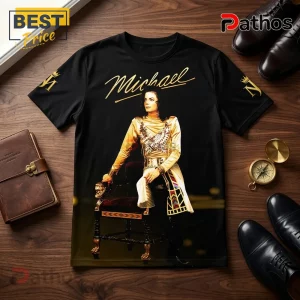 Michael Jackson King of Pop Gold Photo T-Shirt 3 Black short-sleeve t-shirt featuring a gold print of Michael Jackson sitting on a throne with MJ initials on the sleeves.!