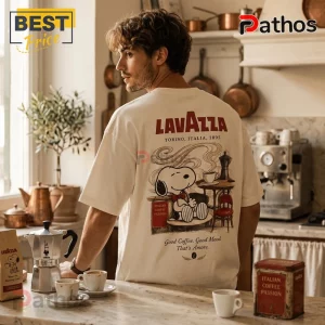 Man wearing an off-white oversized t-shirt with a vintage-style Snoopy coffee graphic and Lavazza branding on the back.!