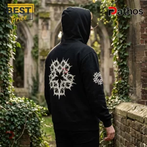 Black hoodie with white death metal style star print on back and sleeve standing in front of ivy covered stone ruins.!