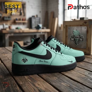 New York Liberty Seafoam Nike Air Force 1 Sneakers 1 Custom mint green leather sneakers with black Nike swoosh, NYC torch logo, and Your Name text on a wooden workbench.!