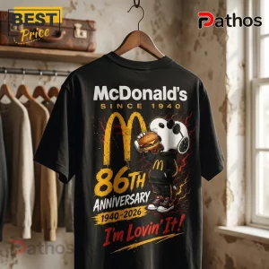 McDonalds Snoopy 86th Anniversary Black T-Shirt featuring Snoopy holding a burger, golden arches, and anniversary text.